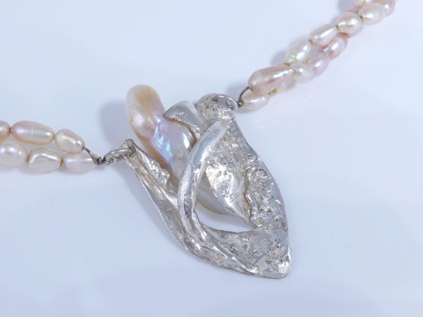 Parel collier met zilveren hanger en barok parel