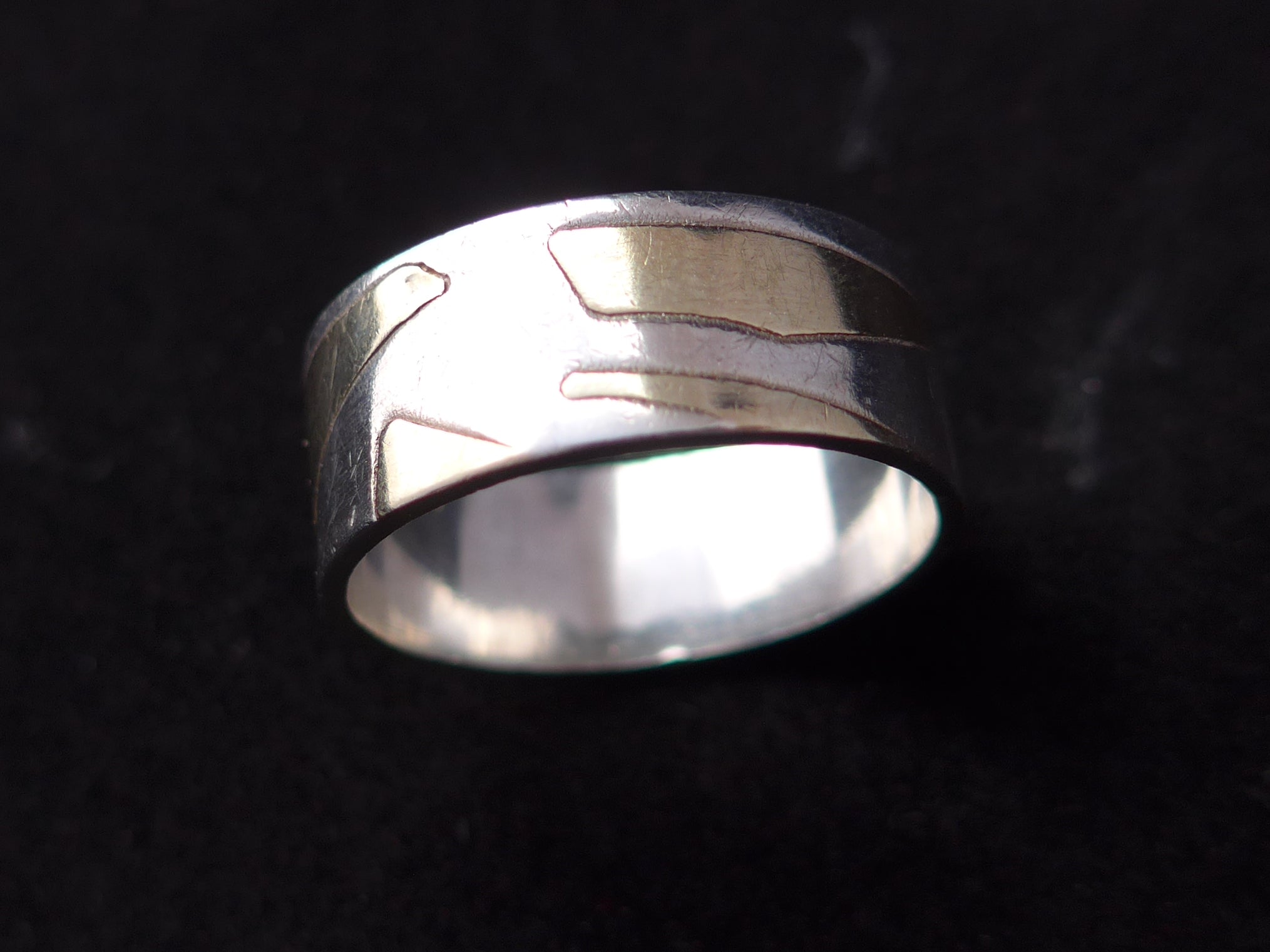 Zilveren ring met geelgouden vlakken