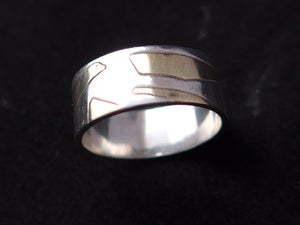 Zilveren ring met geelgouden vlakken