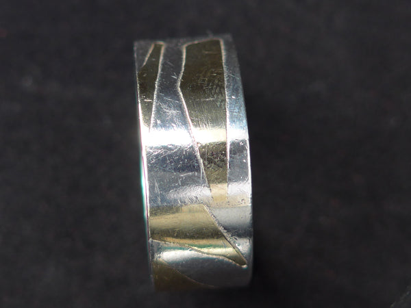 Zilveren ring met geelgouden vlakken