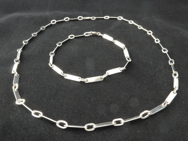 Zilveren collier als lange ketting of met losse armband