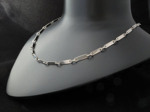 Zilveren collier als lange ketting of met losse armband