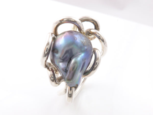 Grillige blauwe barok Zoetwaterparel in zilveren kronkel ring