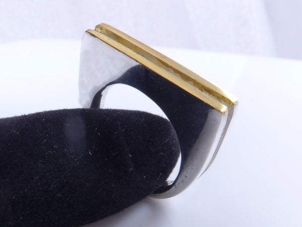 Massieve zilveren ring met geelgouden vlakken
