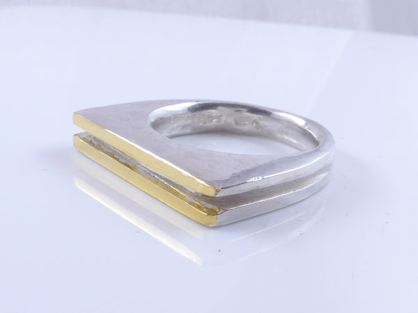 Massieve zilveren ring met geelgouden vlakken